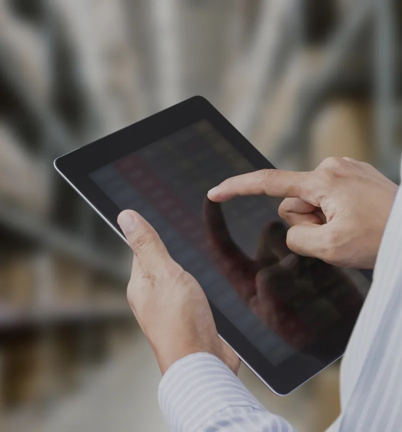 A tablet displaying a spreadsheet with rows of product names and quantities for inventory management.